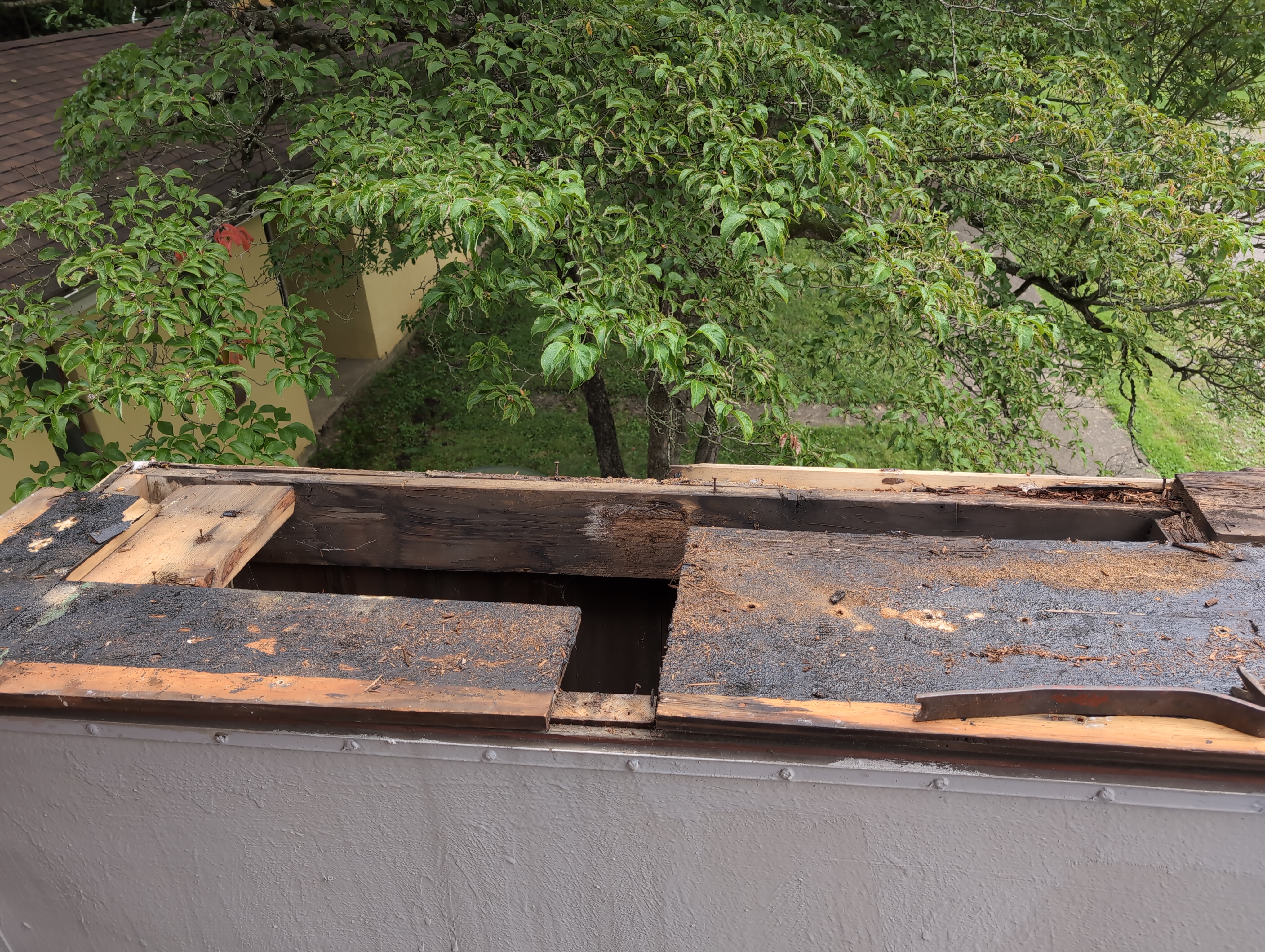 The roofing segment with the completely rotten boards removed. The two boards on the right hand side are still in place.
